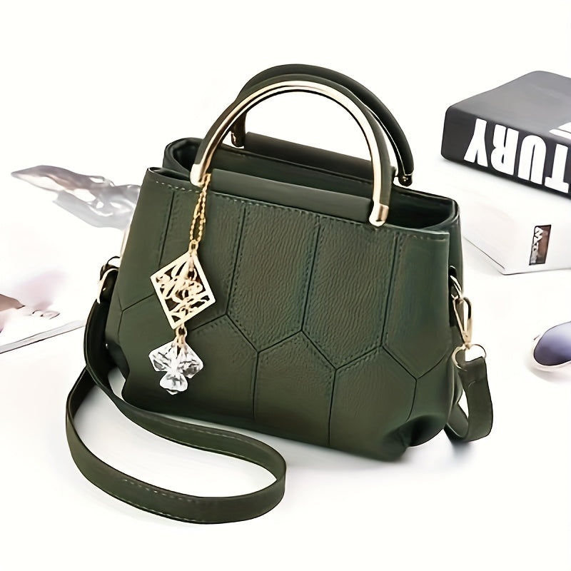 A Stylish Crossbody Bag for Women, Perfect for Everyday Needs, Featuring a Stitched Design, a Golden Chain, And a Decorative Stone.