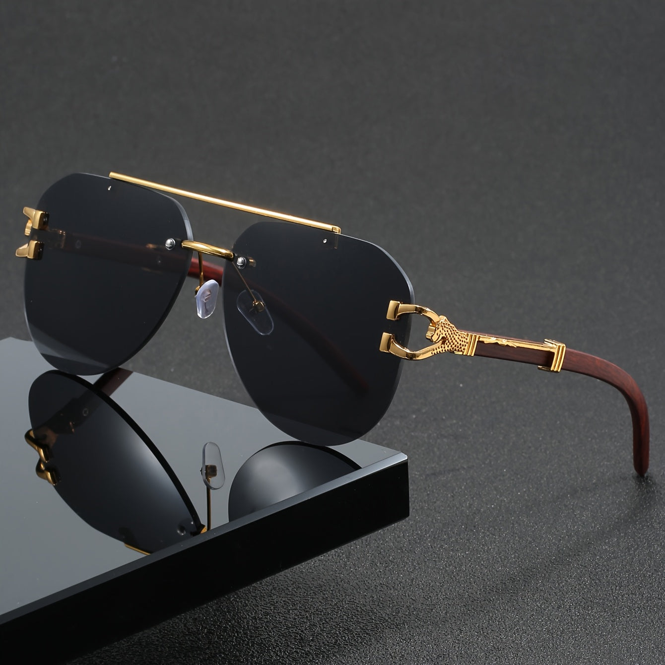 A Pair of Men'S Golden Double-Bridge Frameless Oval Glasses with Leopard Decoration And Faux Wood Grain, Stylish Unisex Eyewear.