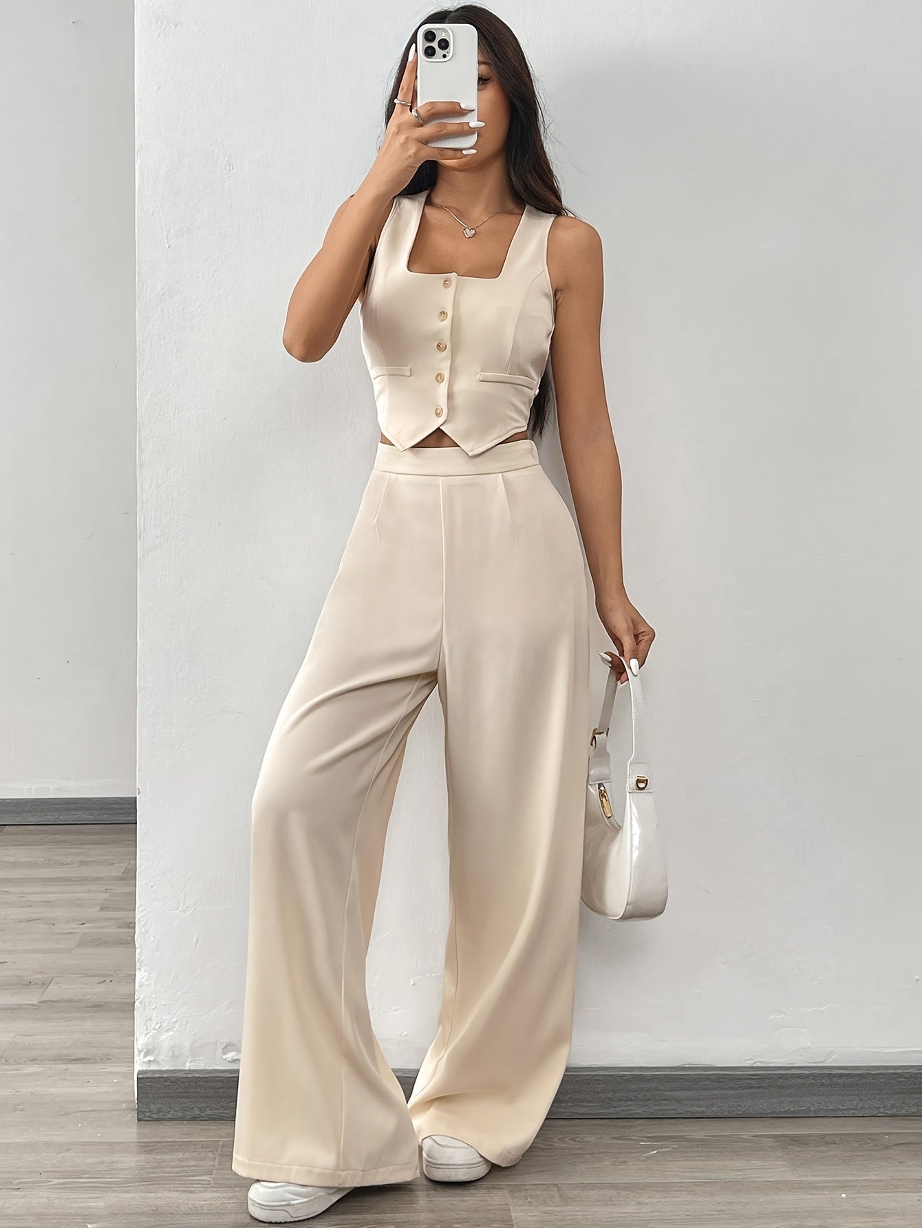 A Set Consisting of Two Women'S Apricot-Colored Sleeveless Cardigans with Square Necklines And Loose-Fitting Wide-Leg Pants.