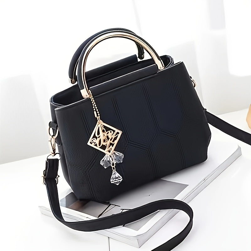A Stylish Crossbody Bag for Women, Perfect for Everyday Needs, Featuring a Stitched Design, a Golden Chain, And a Decorative Stone.