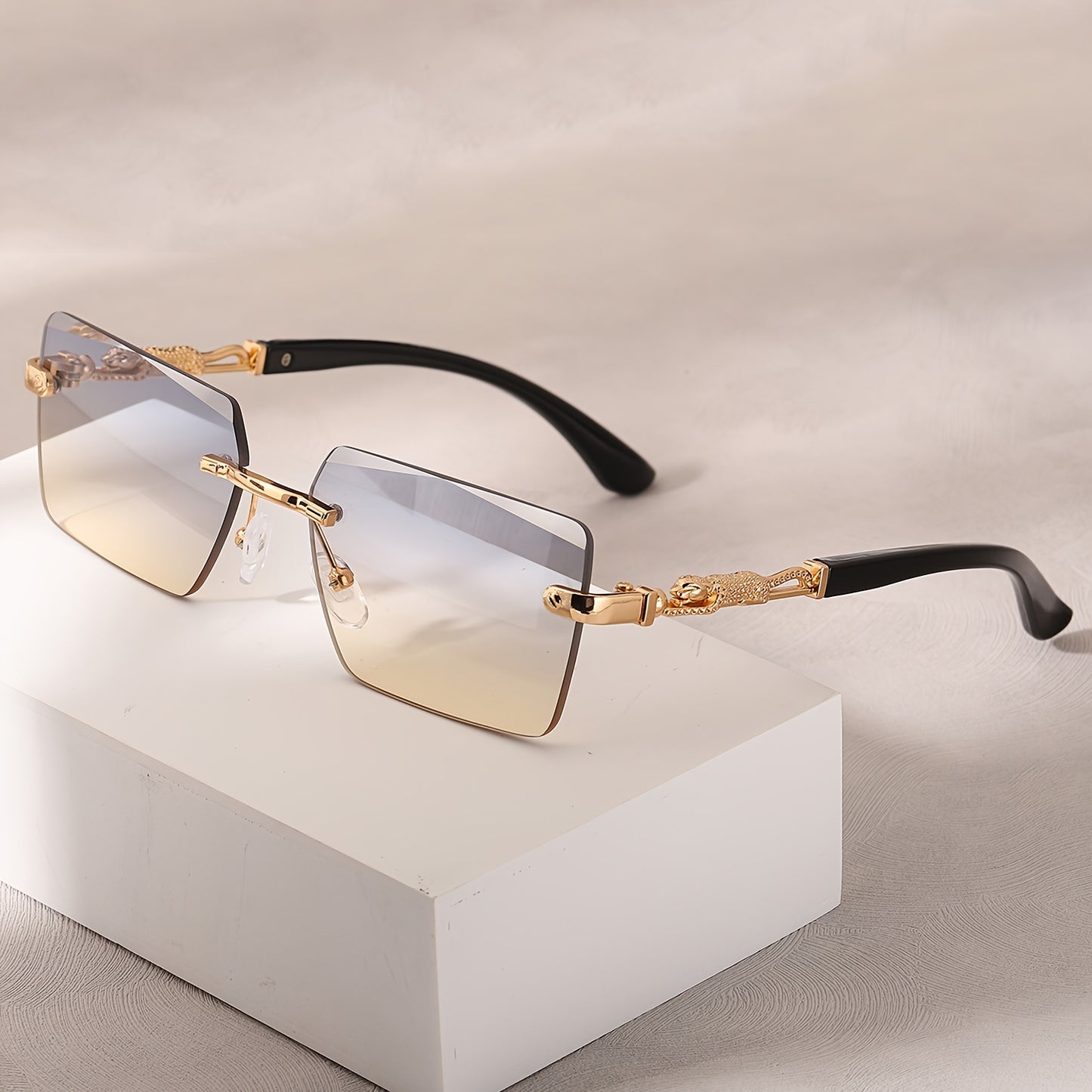A pair of fashionable glasses with a retro style, featuring rimless leopard print temples and a compact trendy frame