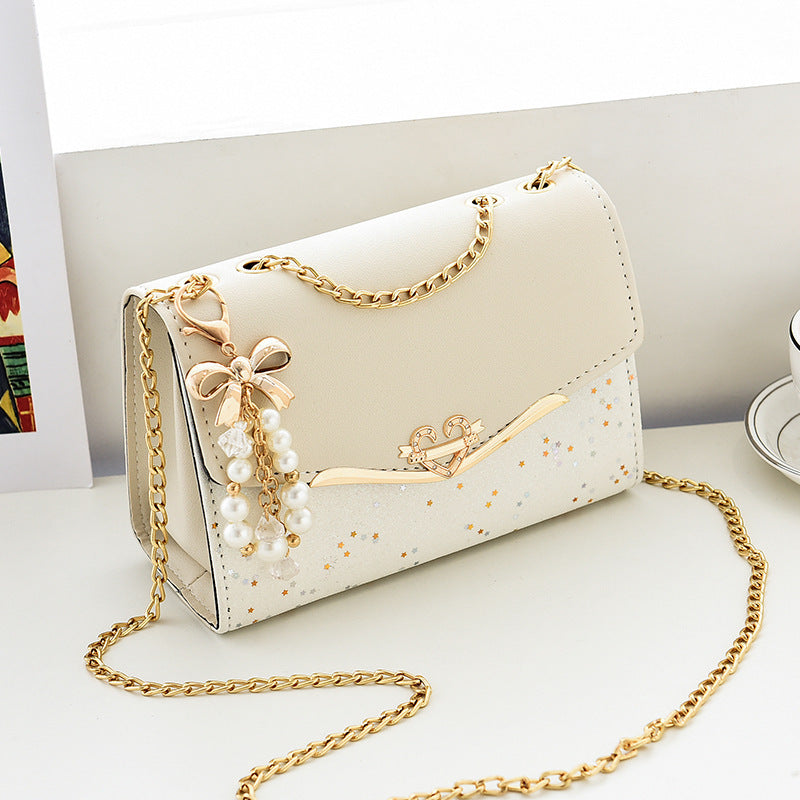 Fashionable New Women'S Shoulder Bag. This One Is a Crossbody Bag with Six Color Options to Choose From. It Is Fashionable Bohemian Beige PU Crossbody Bag with Tassel Charm - City Style Flip-Top Shoulder Bag with Metal Chain