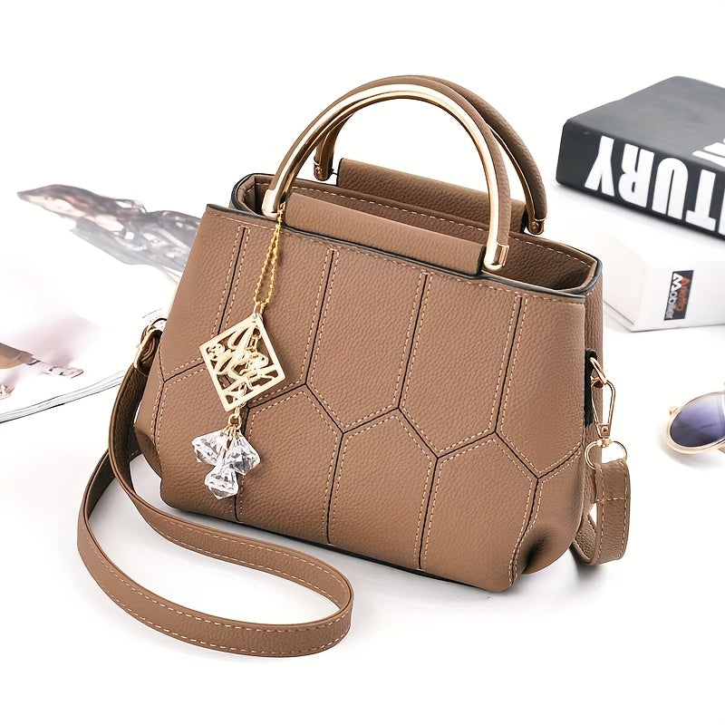 A Stylish Crossbody Bag for Women, Perfect for Everyday Needs, Featuring a Stitched Design, a Golden Chain, And a Decorative Stone.