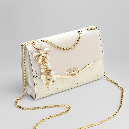 A Festive Mini Shoulder Bag with Shiny Details - Made of PU Material, Lightweight, Featuring an Adjustable Strap And Magnetic Closure, Perfect for Gifting to Family And Friends During The Holidays.