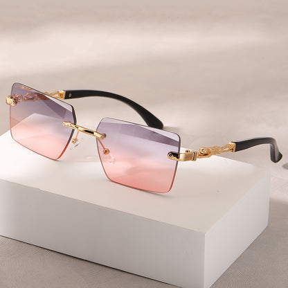 A pair of fashionable glasses with a retro style, featuring rimless leopard print temples and a compact trendy frame