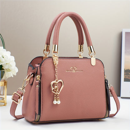 A Stylish And Versatile Women'S Bag with a Large Capacity, Featuring a Minimalist Trendy Design And a Textured Lychee Pattern, Suitable for Shoulder, Crossbody, Or Hand Carry.