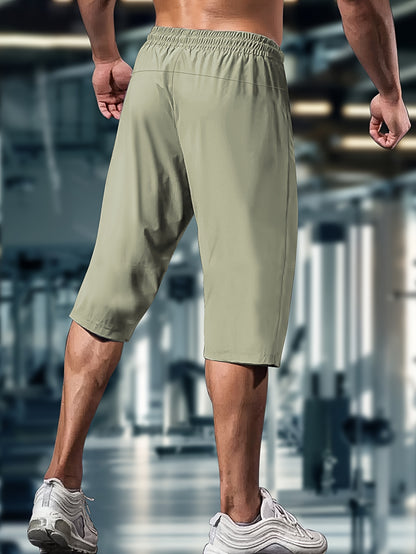 Men'S Summer Capri Pants Made from Highly Elastic Fabric, Featuring a Stylish Drawstring Elastic Waistband And Zip Pockets, Suitable for Casual Sports, Outdoor Activities, And Everyday Wear.