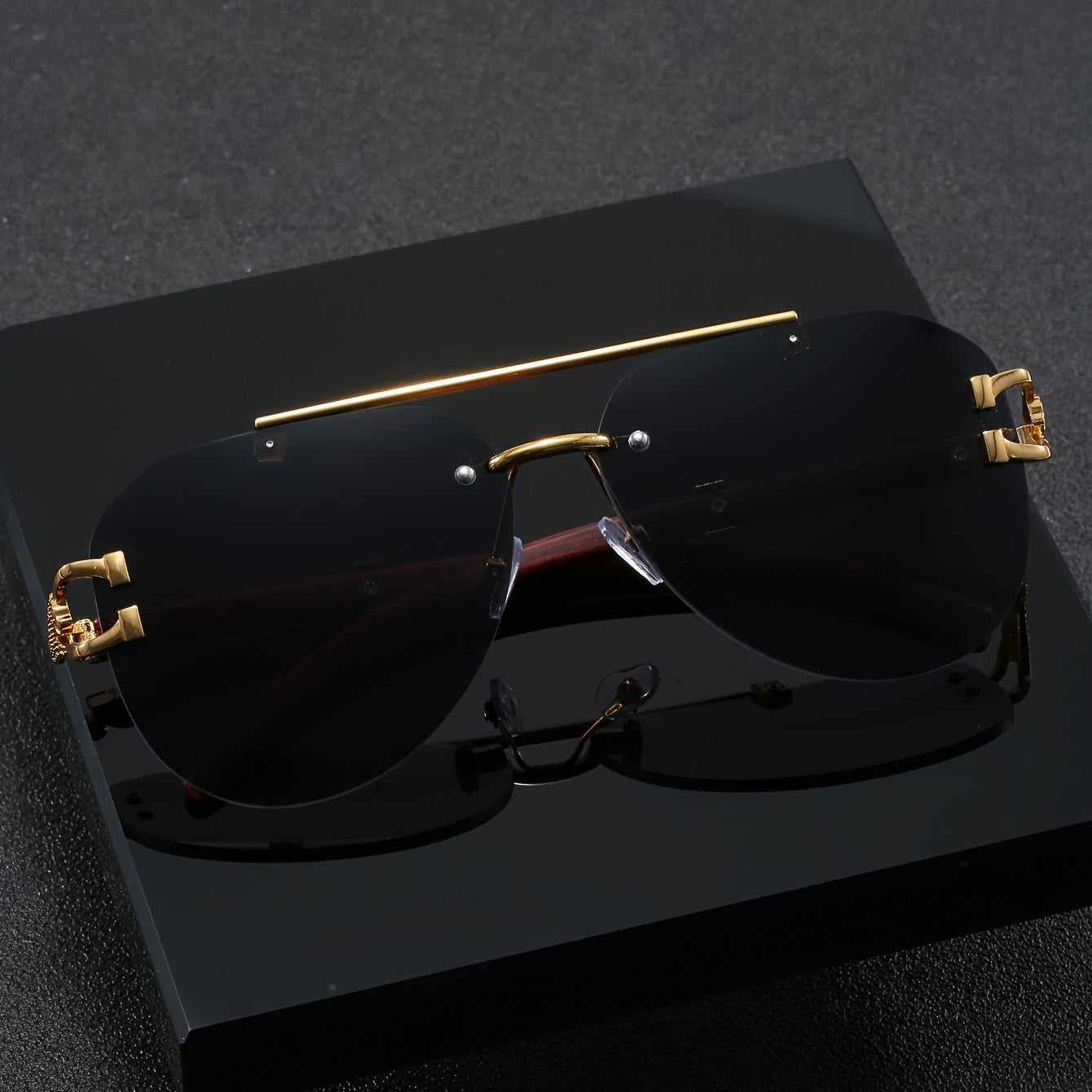 A Pair of Men'S Golden Double-Bridge Frameless Oval Glasses with Leopard Decoration And Faux Wood Grain, Stylish Unisex Eyewear.