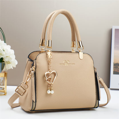 A Stylish And Versatile Women'S Bag with a Large Capacity, Featuring a Minimalist Trendy Design And a Textured Lychee Pattern, Suitable for Shoulder, Crossbody, Or Hand Carry.