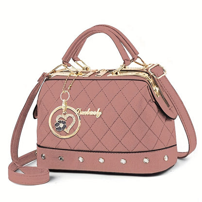 Black Quilted Boston Bag with Golden-Tone Hardware & Adjustable Strap - Elegant Heart Rhinestone Charm, Pattern, and Stylish Stud Details for Wo