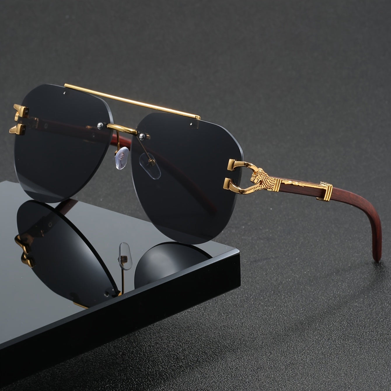 A Pair of Men'S Golden Double-Bridge Frameless Oval Glasses with Leopard Decoration And Faux Wood Grain, Stylish Unisex Eyewear.