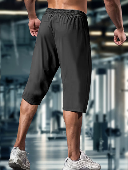Men'S Summer Capri Pants Made from Highly Elastic Fabric, Featuring a Stylish Drawstring Elastic Waistband And Zip Pockets, Suitable for Casual Sports, Outdoor Activities, And Everyday Wear.
