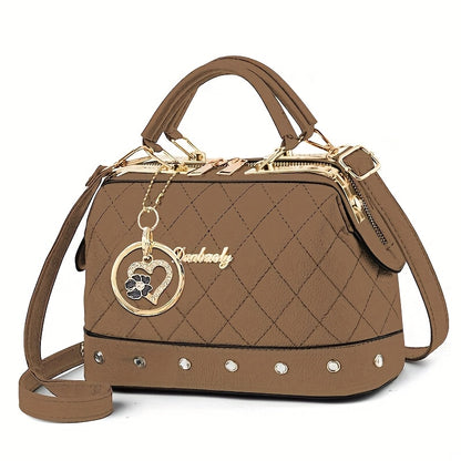 Black Quilted Boston Bag with Golden-Tone Hardware & Adjustable Strap - Elegant Heart Rhinestone Charm, Pattern, and Stylish Stud Details for Wo
