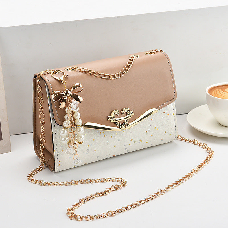 Fashionable New Women'S Shoulder Bag. This One Is a Crossbody Bag with Six Color Options to Choose From. It Is Fashionable Bohemian Beige PU Crossbody Bag with Tassel Charm - City Style Flip-Top Shoulder Bag with Metal Chain
