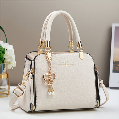 A Stylish And Versatile Women'S Bag with a Large Capacity, Featuring a Minimalist Trendy Design And a Textured Lychee Pattern, Suitable for Shoulder, Crossbody, Or Hand Carry.