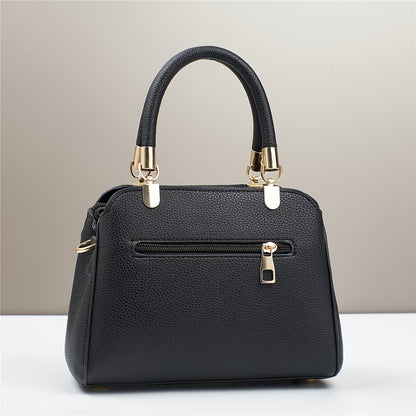 A Stylish And Versatile Women'S Bag with a Large Capacity, Featuring a Minimalist Trendy Design And a Textured Lychee Pattern, Suitable for Shoulder, Crossbody, Or Hand Carry.