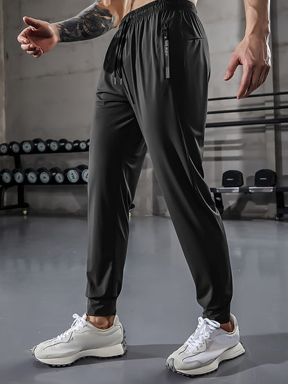 Men'S Athletic Stretch Pants with Adjustable Drawstring Waist, Featuring Zippered Pockets And Solid Color, Quick-Dry Joggers, Perfect for Fitness And Running Workouts.